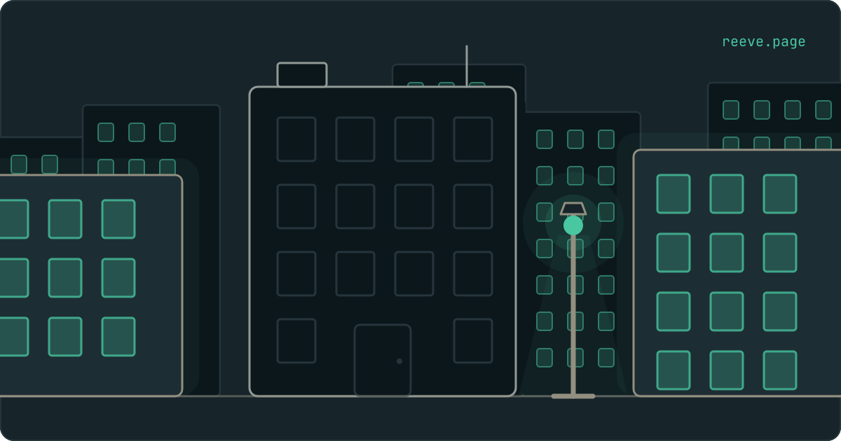 A street of lit buildings at night, and in front of them one building with every window dark.